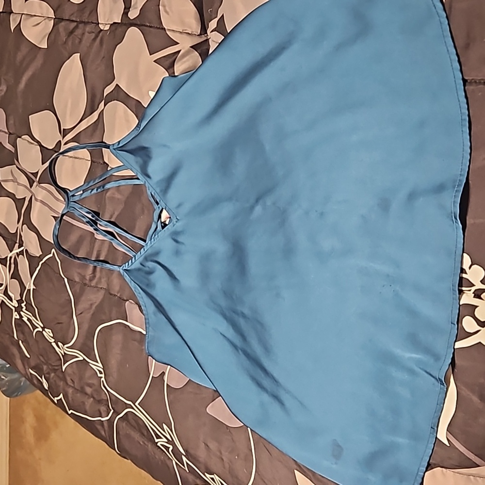A blue satin tank top